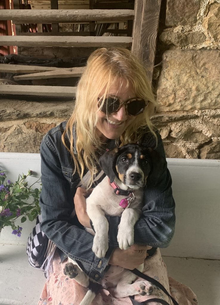 Picture of Andrea Sachs with her foster dog, Olive.